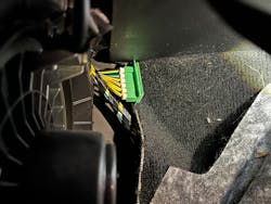 Figure 10- This is a picture of the passenger side CAN bus Star connector. It is located against the right front of a pillar. You can see the edge of the blower motor off to the one side. Figure 10- This is a picture of the passenger side CAN bus Star connector. It is located against the right front of a pillar. You can see the edge of the blower motor off to the one side.