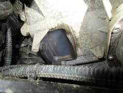 Figure 4- The presence of smoke in the bell housing is indicative of a rear main crankshaft seal leak, as smoke is being introduced to the crankcase/PCV system. Figure 4- The presence of smoke in the bell housing is indicative of a rear main crankshaft seal leak, as smoke is being introduced to the crankcase/PCV system.