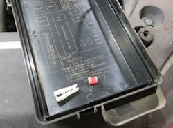 Figure 5- Inspecting the under-hood fuse block confirmed my suspicion was correct. The 10A Ignition supply fuse used by all six coils was now open due to excessive amperage. Figure 5- Inspecting the under-hood fuse block confirmed my suspicion was correct. The 10A Ignition supply fuse used by all six coils was now open due to excessive amperage.