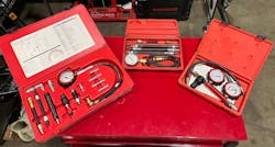 Figure 3- A Matco Tools diesel compression tester on the left, a Snap-on gasoline engine compression tester in the middle, and a Star products cylinder leakage tester on the right. Figure 3- A Matco Tools diesel compression tester on the left, a Snap-on gasoline engine compression tester in the middle, and a Star products cylinder leakage tester on the right.