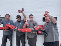 K-O team members show off some of their new tools. K-O team members show off some of their new tools.