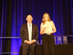 Auto Care Association President and CEO Bill Hanvey (left) with 2022 Impact Award Winner Grace Hovis (right).