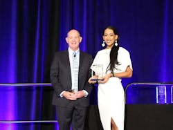 Auto Care Association President and CEO Bill Hanvey (left) with 2022 Impact Award Winner Stacey Miller (right).