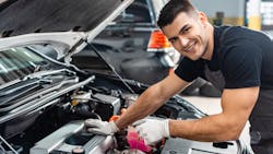 Young technician underhood Young technician underhood