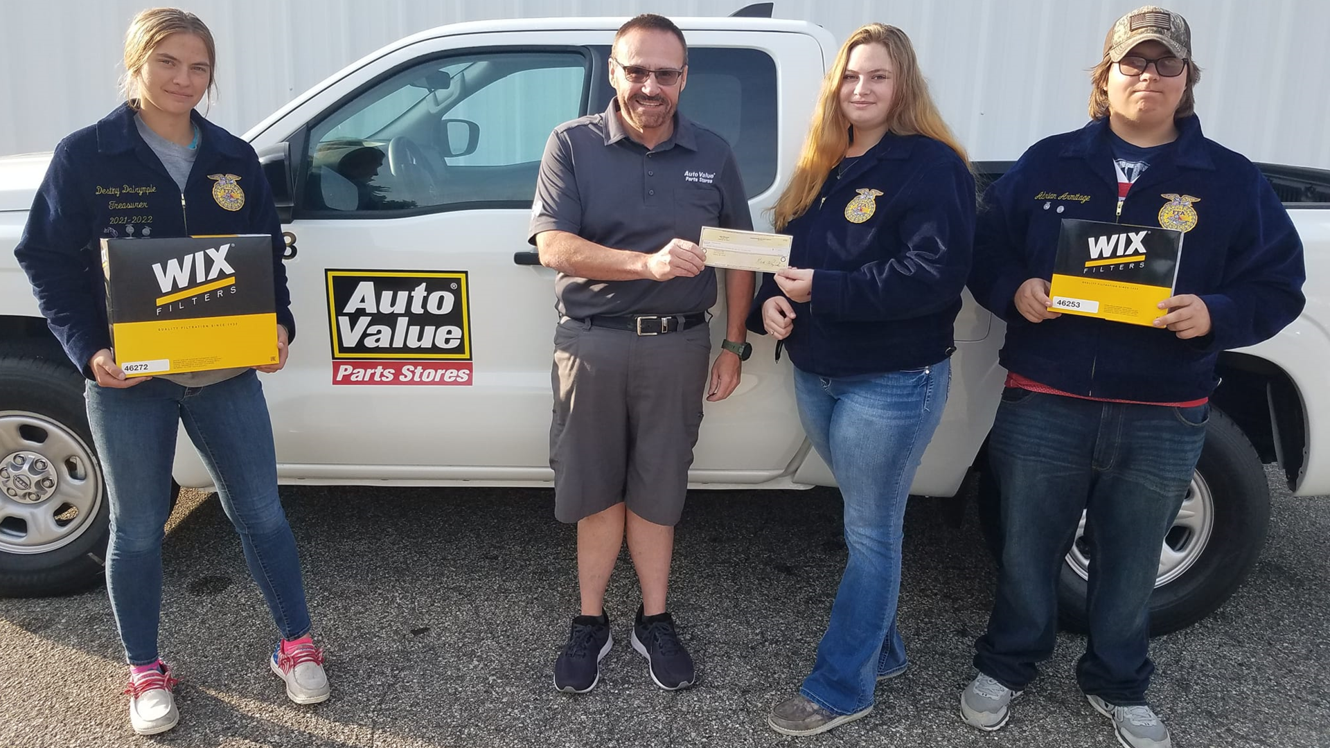 From l. to r.: Destiny (chapter vice president, Chippewa Hills FFA), Dan Reid (store manager, Auto Value Parts Store Remus), Macey (chapter president, Chippewa Hills FFA), and Adrian (chapter historian, Chippewa Hills FFA).