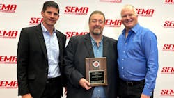 Figure 2- (left to right) Dirk Fuchs, I-CAR Director, Technical Programs &amp; Services, and Bud Center, I-CAR Director, Technical Products &amp; Curriculum, accepting the award receiving runner-up recognition for SEMA Best New Products Advanced Driver Assistance System (ADAS) product category.