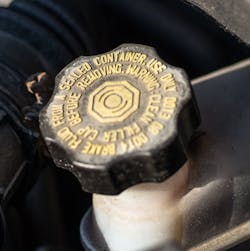 This cap may indicate that DOT 4 brake fluid is required. However, the proper materials standard of DOT 4 fluid must also be met. If not, braking performance may be compromised.