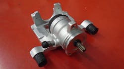 Figure 3: Brand new caliper with the actuator motor removed. The splined shaft visibly meshes with the actuator when installed. Figure 3: Brand new caliper with the actuator motor removed. The splined shaft visibly meshes with the actuator when installed.