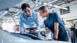 Young man manager and young woman technician