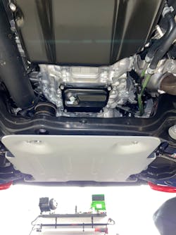 Figure 3- Drain plug located on the front module assembly near the engine. Figure 3- Drain plug located on the front module assembly near the engine.