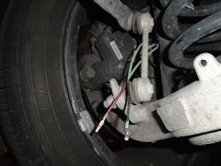 Figure 5: Here's an image of one of my pigtails attached to an actuator motor. Notice how the wires are marked red and black, identifying the proper polarity to retract the caliper piston. Using a tool like a Power Probe can make light work of supplementing voltage and ground to operate the actuators. Figure 5: Here's an image of one of my pigtails attached to an actuator motor. Notice how the wires are marked red and black, identifying the proper polarity to retract the caliper piston. Using a tool like a Power Probe can make light work of supplementing voltage and ground to operate the actuators.
