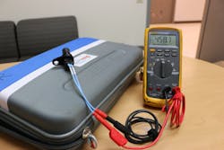 Figure 3- Using a DMM to measure static resistance can provide a critical clue when diagnosing sensor low or no output concerns. This sensor displays a resistive value well within the normalized range of 200-1,000 ohms.