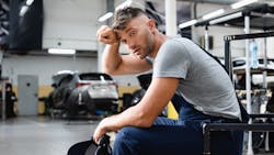 Technician taking a break in the shop Technician taking a break in the shop