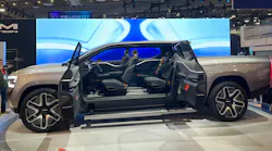 The Ram 1500 Revolution BEV Concept truck features an all glass roof, a steering wheel that can be tucked away, adjustable air suspension, third-row jump seats, and more.