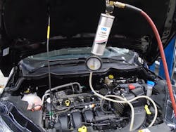 Figure 3- Fuel induction cleaner attached to the fuel rail and set to factory fuel pressure. Figure 3- Fuel induction cleaner attached to the fuel rail and set to factory fuel pressure.