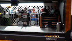 The hutch on Berg's Revel houses a mini Revel from Matco, his new hat collection, and a wall of fame featuring stickers from his YouTuber friends. The hutch on Berg's Revel houses a mini Revel from Matco, his new hat collection, and a wall of fame featuring stickers from his YouTuber friends.