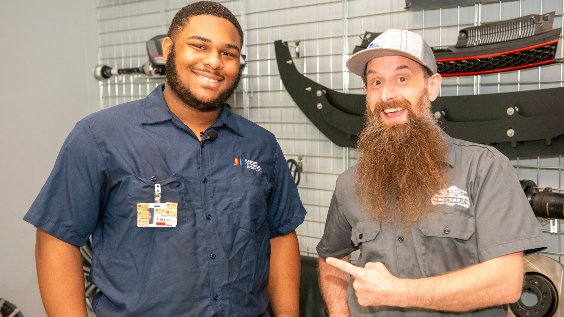 I'Rule Faison (left) won the Humble Mechanic scholarship from the TechForce Foundation. YouTube influencer 'Humble Mechanic' Charles Sanville, right, presented the award to him at the dealership where he was working while attending Universal Technical Institute's NASCAR Technical Institute.