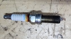 Figure 2- Combustion gasses are passing through the spark plug leaving soot-like evidence behind on the insulator. Figure 2- Combustion gasses are passing through the spark plug leaving soot-like evidence behind on the insulator.
