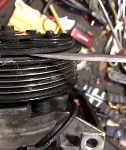 Figure 7- Previous current flow testing of the field coil circuit led to inspection of the compressor clutch airgap. It was indeed found to be almost double of the what the gap specification calls for. Figure 7- Previous current flow testing of the field coil circuit led to inspection of the compressor clutch airgap. It was indeed found to be almost double of the what the gap specification calls for.
