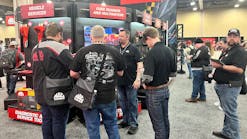 Distributors checking out some of the new Mac Tools diagnostic tools.
