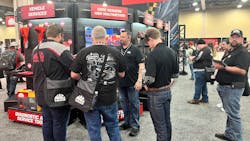 Distributors checking out some of the new Mac Tools diagnostic tools.