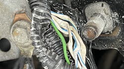 Figure 8- Here is the damage to the harness, visible after it was freed from the bracket. Figure 8- Here is the damage to the harness, visible after it was freed from the bracket.