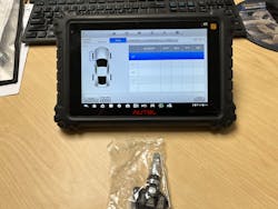 Figure 5 – Autel MaxiSYS MS906TS scanner and a TPMS sensor. Figure 5 – Autel MaxiSYS MS906TS scanner and a TPMS sensor.