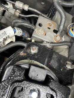 Figure 7- The harness was caught between the mount and bracket. Figure 7- The harness was caught between the mount and bracket.