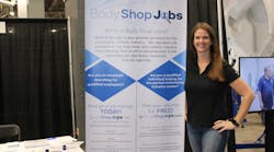President Diane Benting poses for a photo at the BodyShopJobs.com booth at the Tasco Auto Color trade show.