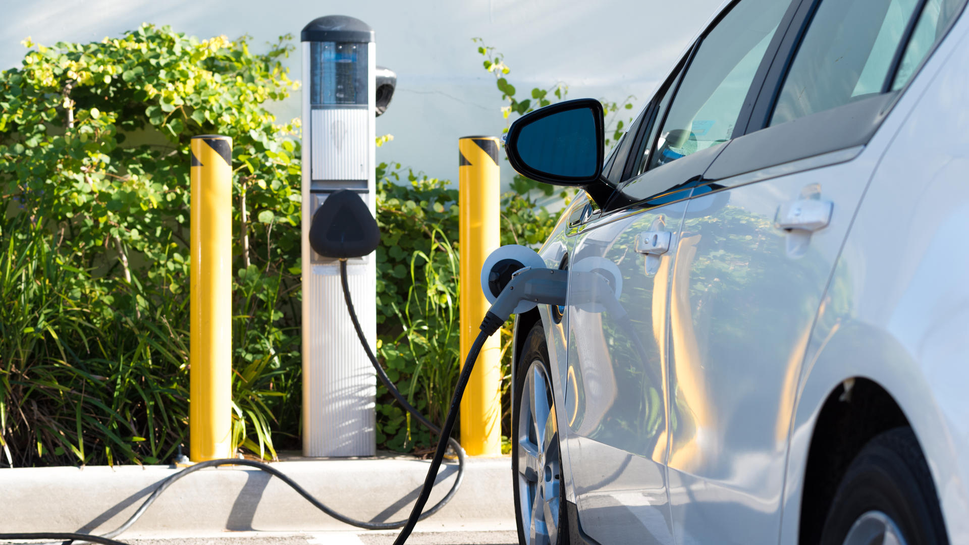 Electric Vehicle At Charging Station