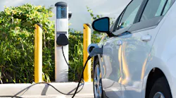 Electric Vehicle At Charging Station