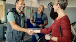 Service manager greets customer