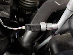 Figure 3- Air conditioning pressure transducer located on the discharge line between the compressor and the condenser. Figure 3- Air conditioning pressure transducer located on the discharge line between the compressor and the condenser.