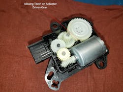 Figure 5- This internal view of an inlet door actuator shows missing teeth on the driven gear, causing the actuator to make a banging noise during operation. Figure 5- This internal view of an inlet door actuator shows missing teeth on the driven gear, causing the actuator to make a banging noise during operation.