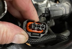 Figure 11- Connector of faulty camshaft position sensor. The damaged sensor allows oil to wick its way into the PCM at the other end if the wire harness. Figure 11- Connector of faulty camshaft position sensor. The damaged sensor allows oil to wick its way into the PCM at the other end if the wire harness.