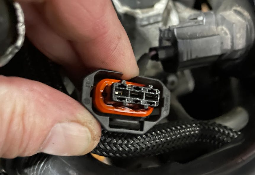 Figure 11- Connector of faulty camshaft position sensor. The damaged sensor allows oil to wick its way into the PCM at the other end if the wire harness.
