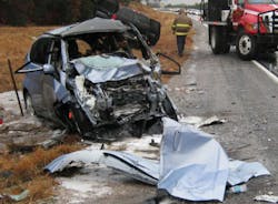 Figure 2- 2010 Honda Fit, picture after roof separated during accident. Figure 2- 2010 Honda Fit, picture after roof separated during accident.