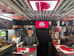 Burns' custom-wrapped desk features the Canadian flag. Burns' custom-wrapped desk features the Canadian flag.