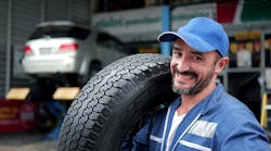 Technician with tire