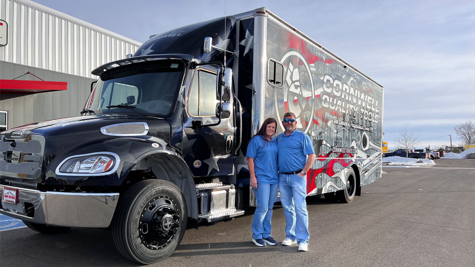 Bourdon and wife Monica in front of their truck.