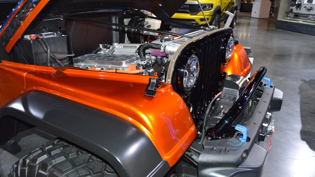 OLD MEETS NEW: The electric motor under the hood of the classic Jeep &apos;CJ Surge&apos; concept vehicle displayed at the 2022 SEMA Show produces a peak output of 200 kW, or 268 bhp. The electric motor is powered by a 50kWh battery pack with 24 modules that is mounted in the rear section.