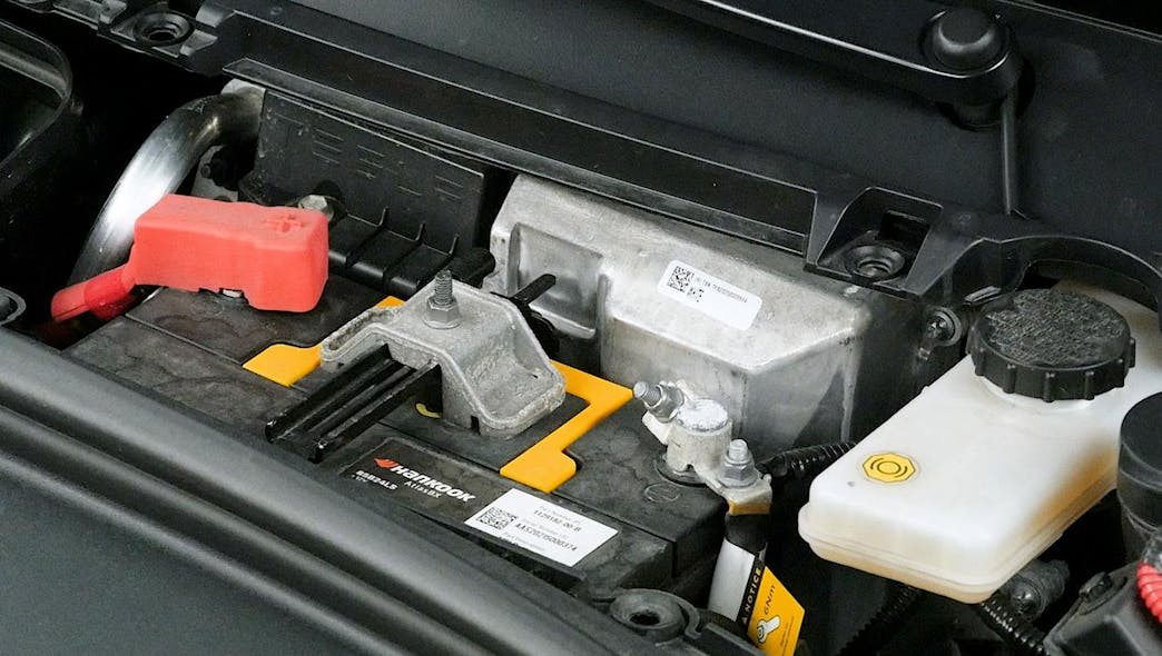 This shows the location of the low-voltage battery system that runs almost all the systems on this Tesla. This shows the older lead-acid AGM battery that is located under all the plastic cowl pieces. If the vehicle has the new lithium-ion low-voltage battery, it is in the same area, but looks more like a module than a battery.