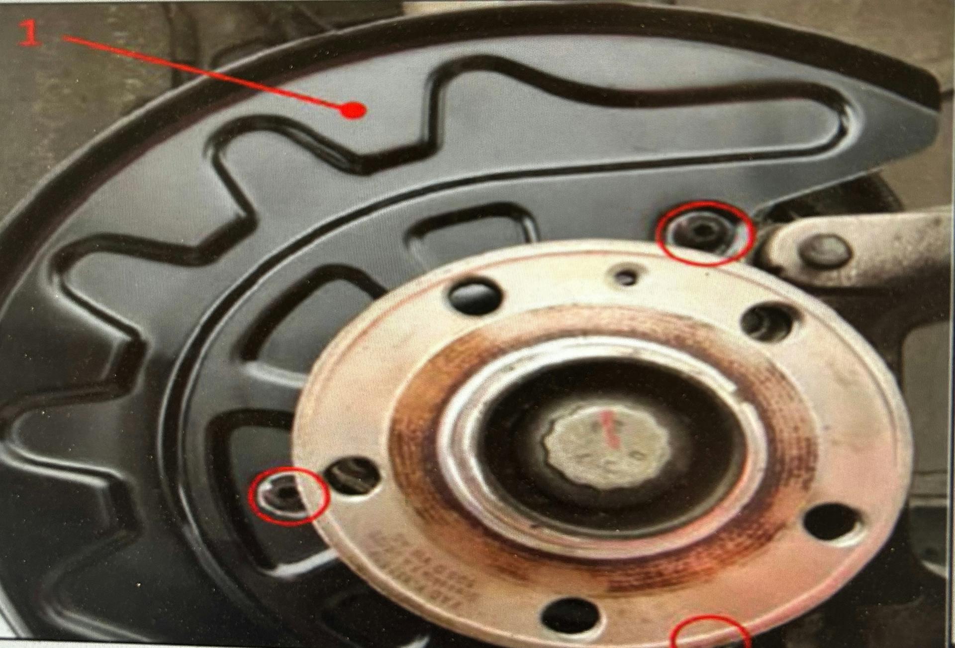 Note the three securing bolts (circled).