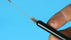 A small rifle brush works great to clean pushrod oil passages. (photo by Mike Mavrigian) A small rifle brush works great to clean pushrod oil passages. (photo by Mike Mavrigian)