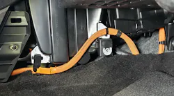 Orange HV cables near the cabin air filter.