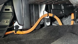 Orange HV cables near the cabin air filter.