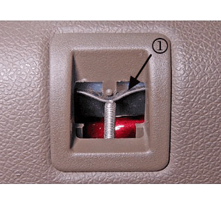 Use a flat-bladed tool to disengage the detent tab.