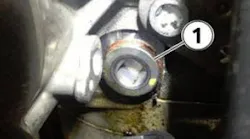 The sealing plug is located just below the vacuum pump. Clean the area, loosen the plug, and re-torque to 40 Nm. Be sure to use an 8mm square drive bit.