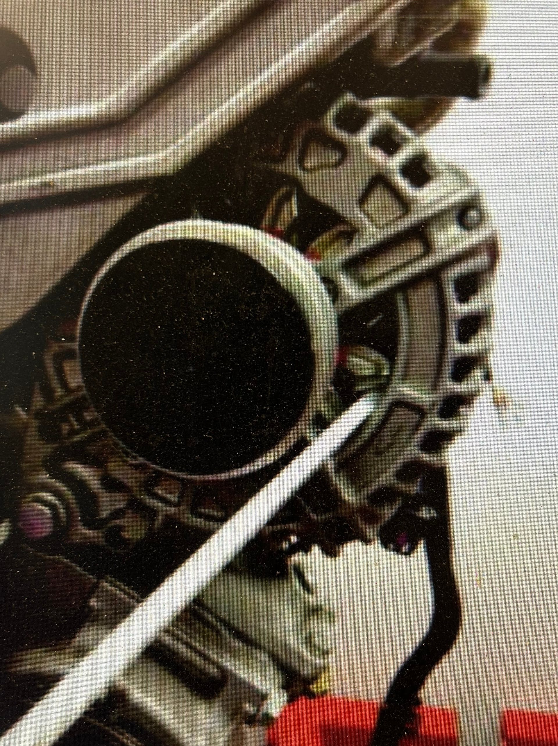 With the belt removed, hold the generator fan blades and try to turn the pulley. If the pulley spins freely in both directions, replace the generator.