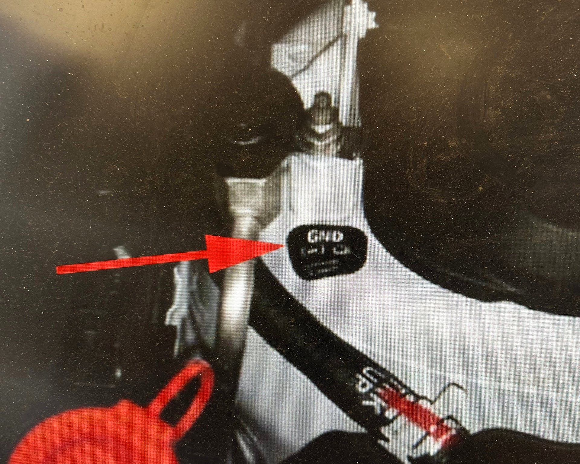 Install a ground point label as shown. This will provide a ground location for future jump starts.